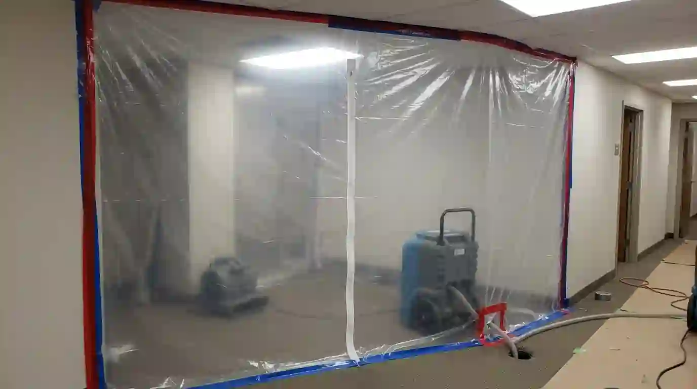 Dehumidifier draining into a tub inside a sealed drying area
